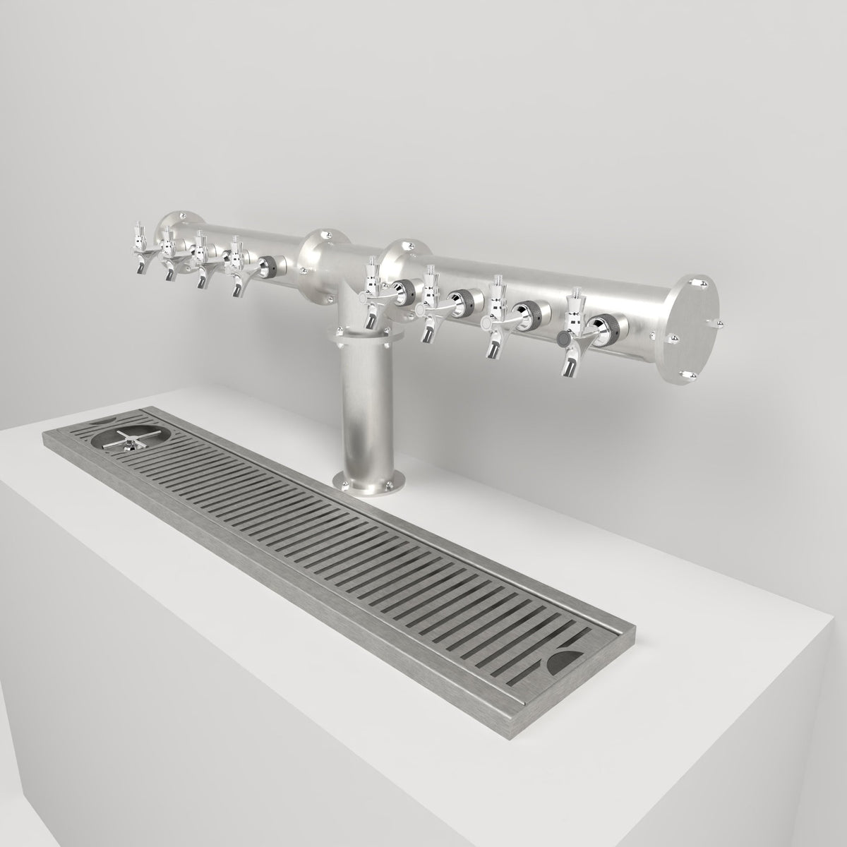X-Pressed drip tray in brushed stainless steel on the counter under a tee beer tower, three-quarter view